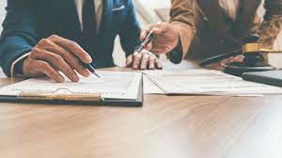 Close-up of attorney calculating damages in a settlement negotiation